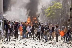 ANI-pic Protestors throw brick-bats during clashes between ani-CAA protestors and the Supporters group of the Citizenship act
