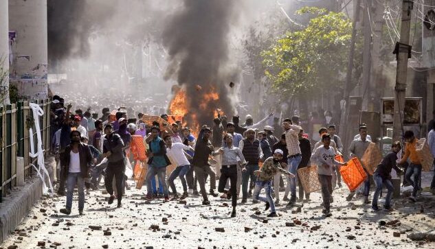 ANI-pic Protestors throw brick-bats during clashes between ani-CAA protestors and the Supporters group of the Citizenship act