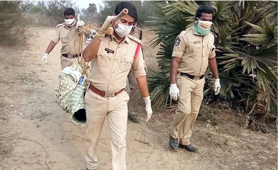 Police carried the body of an unidentified man on their shoulders and covered a distance of three kilometers