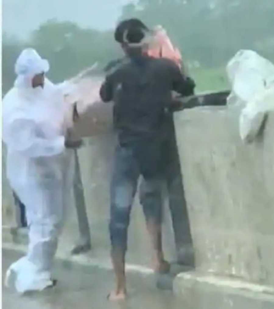 up-balrampur-two-men-caught-on-camera-throwing-covid-patients-body-into-river