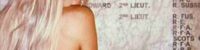 A women tourist naked topless at a war memorial