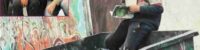picture-of-a-child-reading-a-book-sitting-in-the-garbage