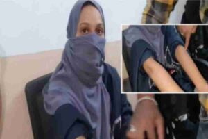 Sub-inspector of police attacked a burqa-clad woman with a stick