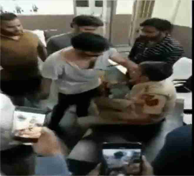 viral video shows constable beaten by mob inside police station