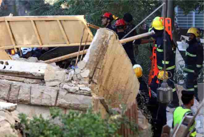 a four storey residential building collapsed in amman the death toll rose to five and 14 people were injured