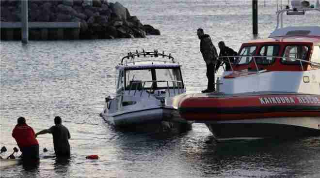 five people in new zealand have died after boat capsizes after hitting whale