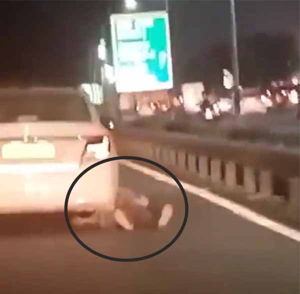 delhi after robbing a taxi the driver was dragged for 200 meters