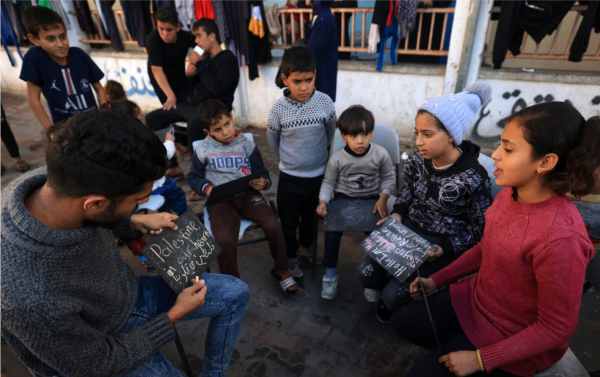 after the destruction of the school palestinian children were taught on the pile of rubble