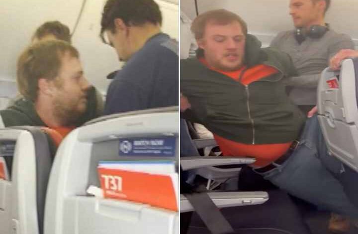 man tries to open plane emergency exit door on american airlines flight to chicago