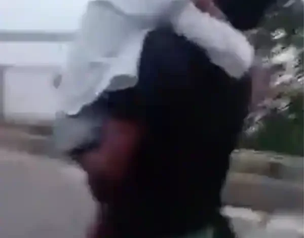 father running with sick son on closed bridge